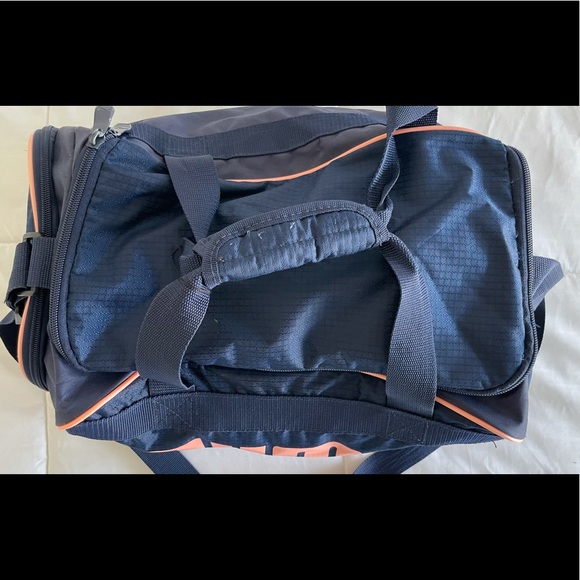 A navy blue and baby pink Puma duffel bag. - Picture 3 of 7